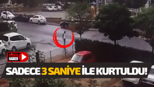 Trafik kazasında, yolda yürüyen yaya 3 saniye ile kurtuldu